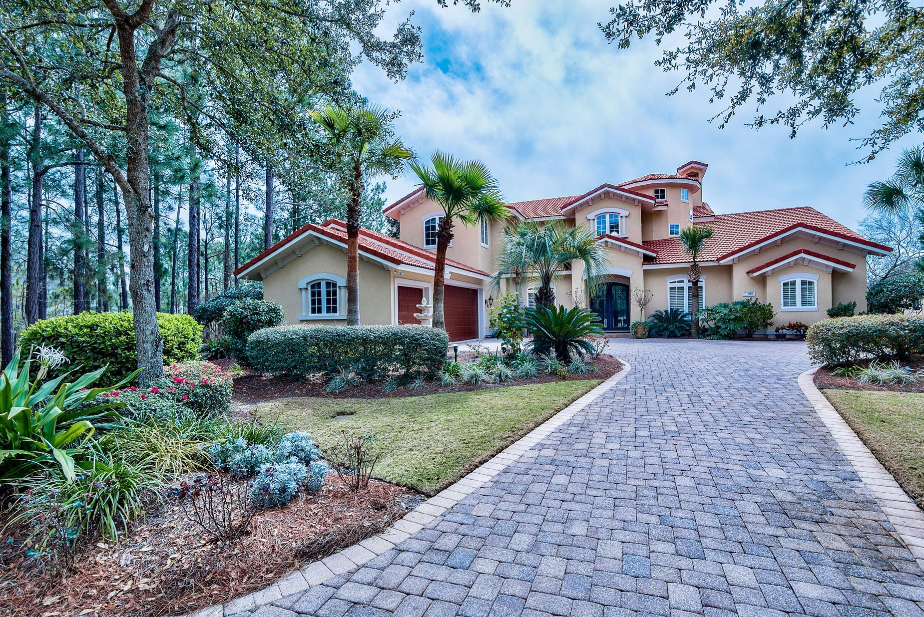 Stunning Mediterranean style estate located at the end of private cul-de-sac with picturesque views of the 17th fairway of the Raven golf and lake. The driveway is lined with brick pavers leading to the 3-car garage. This home is aesthetically pleasing with quality architectural designs including curved archways, smooth rounded corners, stately columns, soaring cathedral ceilings, gas fireplace, built-in shelving, triple crown molding, and spiral wood staircase accented with cast iron railings. In addition, this home offers wood & tile floors throughout the common areas and carpeting in the loft and bedrooms. Bring your cookbook because you'll love cooking and entertaining in the large kitchen featuring double ovens, a gas stove, two sinks, an island, and tons of counter and storage space.