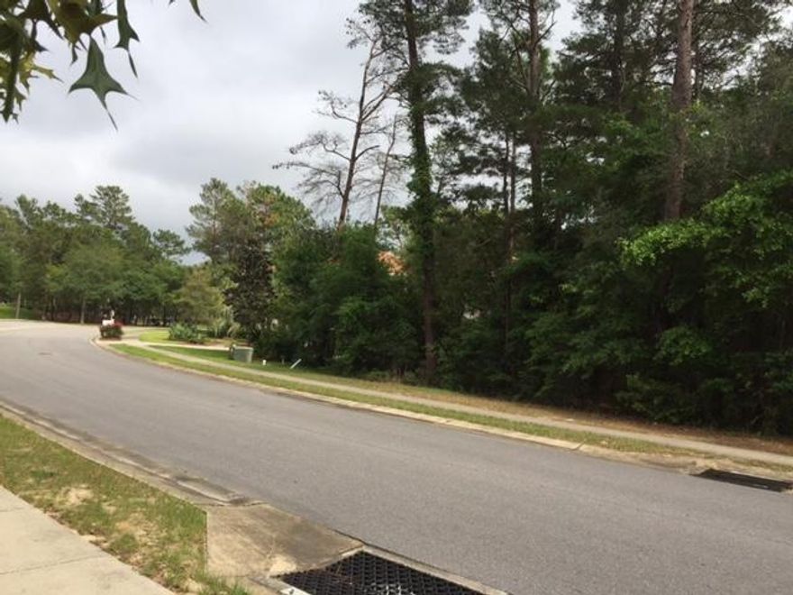 Large nearly 1/2 acre level lot on corner close to tennis courts and pool and club house in desirable Swift Creek. Drive by and see. Aerial photo in Documents