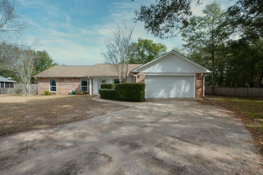 Nestled in a private wooded cul-de-sac, is 6876 Avenida De Galvez. As you enter, you will enjoy real hardwood floors throughout this large living space. Located off the family room, you will find a remodeled kitchen boasting granite countertops, updated cabinetry, brand new lighting, stainless steel appliances and custom floor tile with decorative inlays. An inviting master suite containing ceramic wood look tile,sits privately across the home from guest bedrooms. Further updates to the home include matching granite countertops in the guest bathroom and laundry room. As you exit the home, you and your family will enjoy a large fenced private backyard, accompanied by concrete pavers leading to a fireplace. This home will be perfect for your family to gather around wood burning fireplace wood burning fireplace during the colder season, and allows close access to East Bay to immerse yourself in Florida living. 