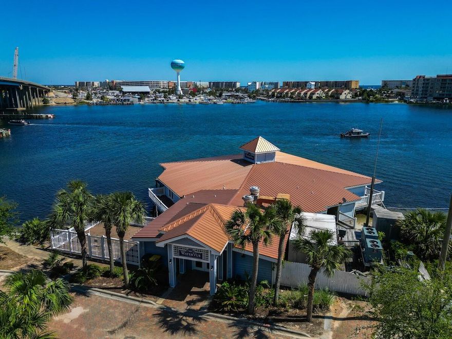 Here, on the sound side of Fort Walton Beach, is the premiere location of a unique commercial property. If the investor in you has ever thought 'wow, I should have bought that when it was available for $ because now it's worth $$$$', then seize this chance to make it happen for you!Brooks Street Landing Commercial Condominium consists of two buildings and the common elements which convey with this offering.  First, the single-story multi-use building is located directly on and over Santa Rosa Sound.  Its architecture extends over the water and lends itself to flexible  marketing  options including entertainment, corporate events,  restaurant and lounge or other high-capacity seating needs. It is currently leased on demand.  This building has many potential uses. cont'd The second building is a well-maintained, three-story commercial office building with each floor a separate commercial leasing opportunity.  It has an elevator accessible to the lobby for each condo.   The southernmost office areas have large windows which provide stunning vistas of the water. 
Additional property features include a sub-lease of shared parking with city of Fort Walton Beach providing significant availability to park under the Brooks Bridge.  There is potential for having the submerged State land lease at waterside of the property expanded allowing for a marina, subject to State approval. The panoramic views of the intercoastal waterway will be enhanced following completion of the new bridge which will be 15 feet higher than the existing bridge. 
