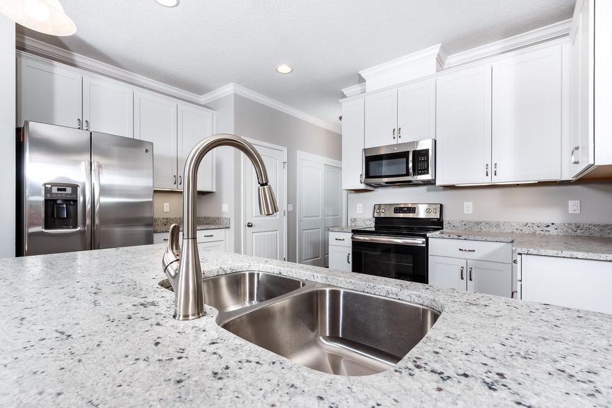 Side walks, street lamps, large lots, and mature trees provide for a slice of southern charm in this great neighborhood! This 4 bedroom, 3 full bathroom home features stainless steal appliances, granite countertops, white cabinets, bookshelves, an open kitchen and living area combo, and a split bedroom single floor floor plan. There is a separate dining area along with an additional office space for all of your working needs. The master bathroom is equipped with double vanities, a large garden tub and shower, and his and her walk in closets. The home provides for plenty of natural lighting to look directly onto your half acre back yard. Outside, the two car garage has a small room for air conditioned extra storage. Home is just 4 miles to Publix and Crestview High School!