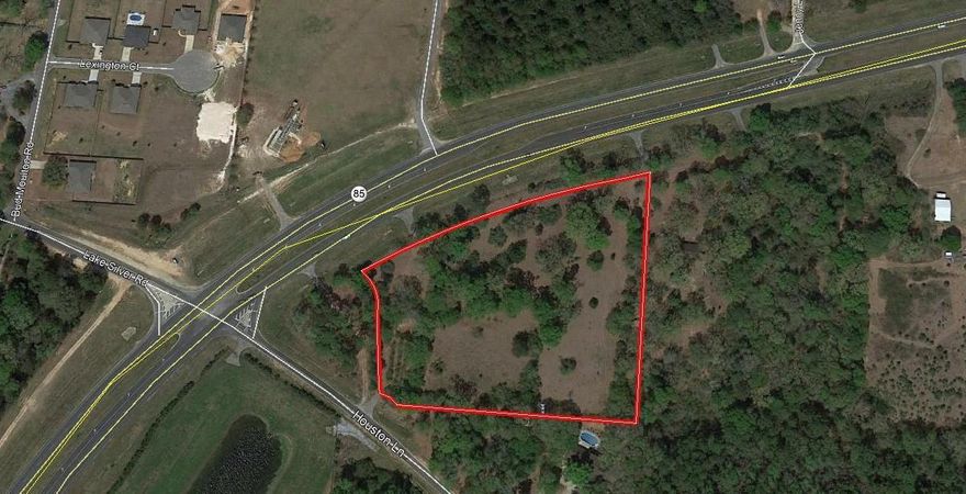 Property zoned mixed use. Wooded property on Highway 85. There is an entrance off Houston Lane. There is a storage shed on the property the house has been removed. Perfect place for a business with 760 feet of highway frontage.