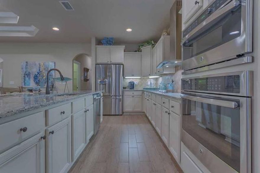 YOU MUST SEE THIS HOME! Large Corner Home site! Brand New Construction featuring beautiful Hand painted bisque cabinets, Granite Counter and Vanity Counter tops, Hardwood flooring as you enter in foyer, Family room, Dining Room and kitchen. Kitchen features Large Island great for Entertaining. Large Master Bath With a tile shower, Garden tub and walk-in closet. Stainless Steel GE Drop in cook top, Built-in oven, Microwave and Dishwasher. Very large garage for work space and/or multiple cars. This is a spacious one story home featuring over 3,000 sq. feet with a beautiful view of the Preservation right off your covered back porch. You have got to see the Virtual Tour. Come see your Brand New Home today!