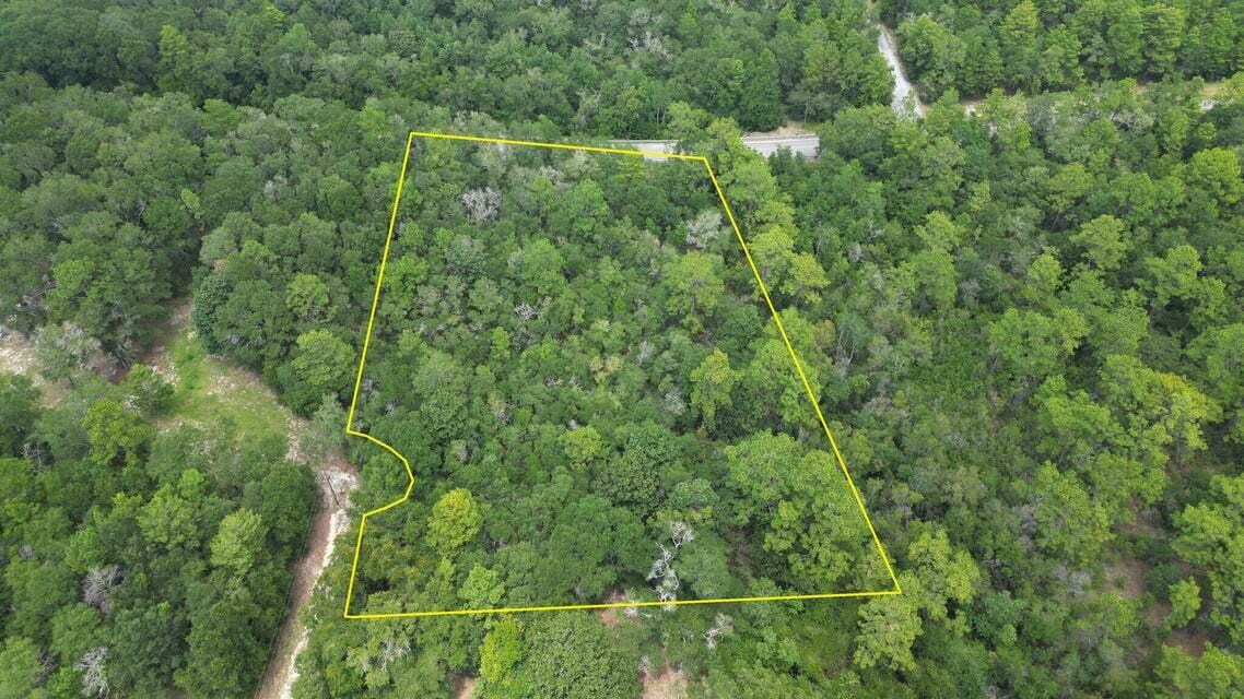 This 1.74 acres provides serene country living in an area which is currently expanding providing more homes and job opportunities with new distribution centers, such as Amazon. The county has future plans for a 10K acre state park for future recreation. Examples of current recreation / water sports: King Lake, 3 springs in neighboring town PDL, and the white beaches from Pensacola to Port St Joe. Short drive to local entertainment, shopping, eateries, not to mention the interstate access to other entertainment and Military bases. Zoning is Rural Residential.1 unit per 2.5 acres The lot is raw ,no tap in fees have been paid, septic needed, public water & electric available. See photos for information PER the GIS Map for soils, flood zone , which is X, zoning, topo, & wetlands