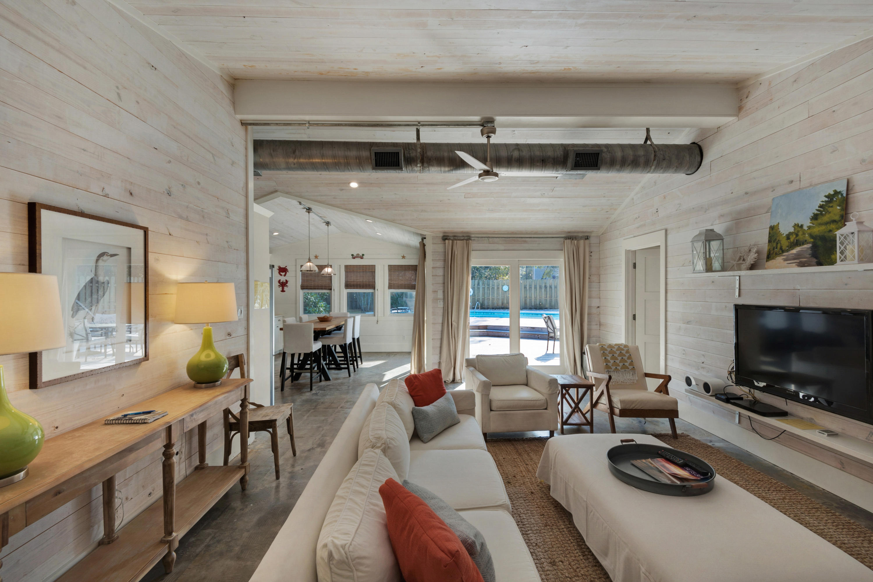 This designer one-level, rustic-modern beach house in Old Seagrove offers 3 bedrooms & an open, easy plan that beautifully integrates outdoor poolside living & indoor sanctuary. Historic Old Seagrove Beach neighbors the popular destination of Seaside, Florida, offering boutique shopping & dining amenities at arm's reach. Discover privacy on this almost quarter acre lot, a spacious sun deck & private pool, moments from the Gulf of Mexico. Tastefully remodeled with stylish mid-century & industrial flare, natural concrete floors meet wood-paneled walls & ceilings, offering an architectural perspectivemaking beach house living a luxury. Here, character resides around every corner. Homes with these offeringsthis coveted location & price-pointare almost unattainable & should not be missed.