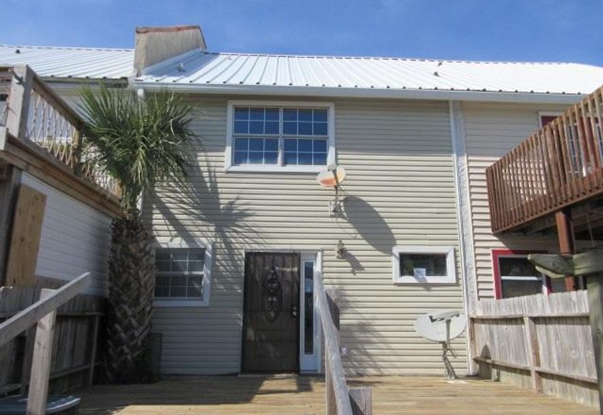 With a little love, this 2 bedroom, 2.5 bath REO townhome would be the perfect home, vacation home or investment property! The home features a stone fireplace, plenty of great closets, an open kitchen and a small peak of the Gulf. The baths have some updating and the ceilings are raised and pitched. There are great decks off the front and the back as well as a 2 car garage. The location is close to all the resort has to offer!
