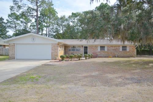 AFFORDABLE 4 Bedroom Home in the heart of Niceville! This all brick, 1 story ranch home features a large family room with wood burning fireplace, separate Living and Dining area, and recently remodeled, eat-in kitchen. The cook will love the Maytag double ovens, ceramic cook top stove, deep under mount sink and Corian counter tops. The Master Bedroom boasts a new laminate wood floor and Mstr bath was recently updated. Vintage chic hall bath featuresnew toilet and faucet. New ceiling fans in all bedrooms, new storm door and beautiful front door, and popcorn ceiling was removed from most of the home and garage. Sliding glass doors lead to the huge backyard with shed and new 10x20 workshop/storage building. Sidewalks invite you to stroll to Lion's park, where there's a boat launch. Less
