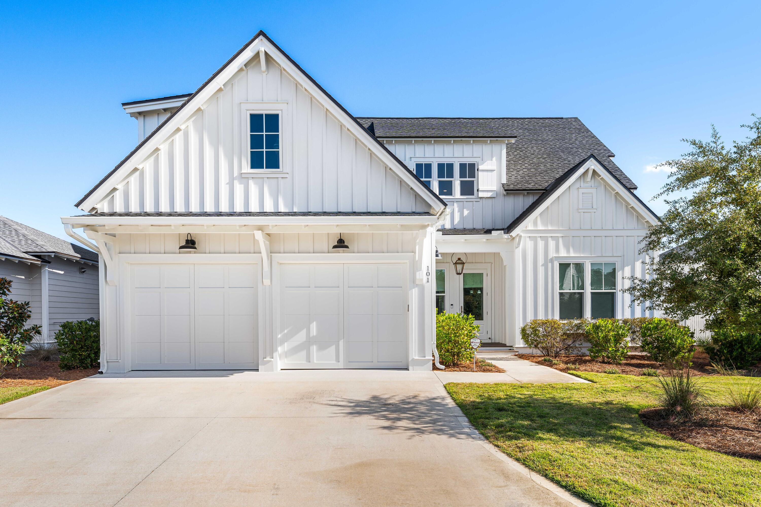 Discover luxury living in this charming Watersound Origins home. This rare Romair Suffolk model offers ample space for comfort and relaxation. The open-concept design seamlessly connects the kitchen, dining room, and great room, creating an inviting atmosphere for gatherings and entertaining. The spacious great room features a fireplace and sliding glass doors. Enjoy the beautiful covered porch, extending your living space outdoors. The kitchen is a culinary dream, boasting Bosch stainless steel appliances and a stunning 10-foot island with custom pendants. Adjacent to the kitchen, the dining room features built-in bench seating, blending style with practicality and offering convenient storage underneath.  Experience the perfect setting for both relaxation and entertaining.