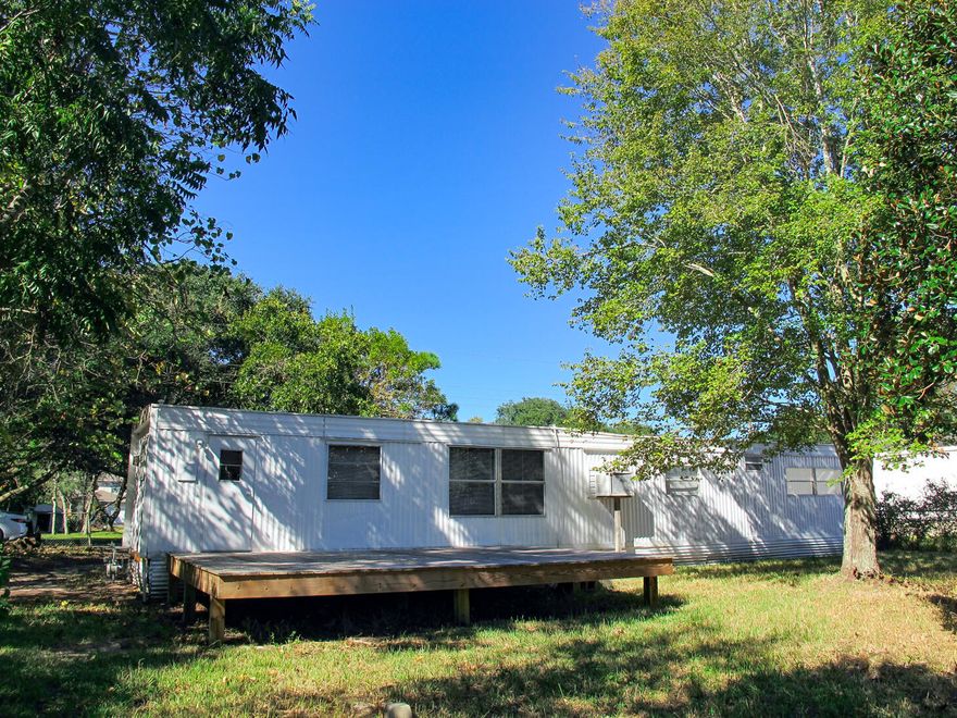 So many options, so much potential! This Sound-view mobile home is in good shape despite its age, and with just a little TLC, could be an income-generating rental. Or live there for a while as you plan to build your dream home on the sizeable shaded lot. The large open deck out the back door is a great place to relax, barbecue and watch the water, which is also visible from the living and dining areas and partially from the bedrooms. The spacious living room looks out a large picture window, over the back deck and through the trees to the Sound. It is equipped with a wall AC/heater unit for climate control. The kitchen has a full-sized gas range and plenty of cabinets for storage, with additional built-ins in the dining area. Keep reading...