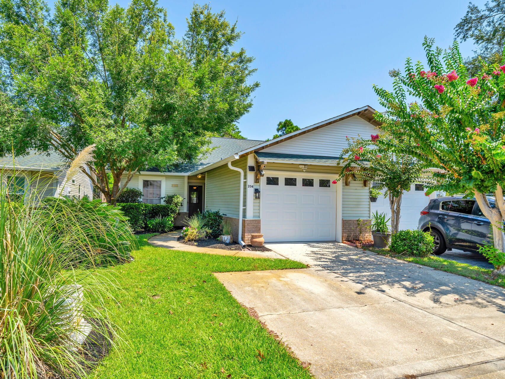 Price Reduction: Take advantage of the $25,000 price reduction on this fantastic property. Welcome to 204 Via Largo, a charming ONE level, 3-bedroom, 2-bathroom home located in the friendly Santa Rosa Beach neighborhood of Escada. This beautifully maintained residence features an open floor plan that allows for a relaxed flow throughout, with large windows and doors that fill the space with natural light. The spacious main living area seamlessly connects to a generous dining area and a well-appointed kitchen with elegant granite countertops and a built-in mini bar, making it perfect for entertaining. The roomy master suite offers a private retreat with an ensuite bathroom and a walk-in closet. Two additional bedrooms and a bathroom complete the home's interior. Step outside to a large covered patio that provides ample outdoor living space, overlooking a private backyard - an oasis for relaxation or gatherings under the stars.
Located in a community that offers a swimming pool and groundskeeping, this home also provides access to a scenic trail that leads directly to the pristine beaches of 30A. Combining comfort, style, and the best of coastal living, this property is a true gem in a sought-after location.

Water Heater 1 year old, Roof 2 years old, HVAC 1 year old, Fence 1 year old.