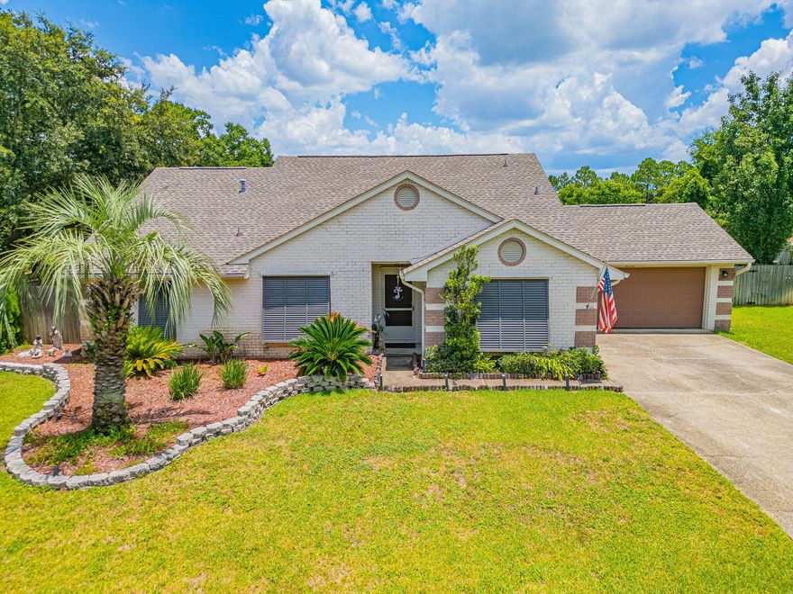 VA ASSUMABLE LOAN for qualified buyers at 2.25% and an option to finance the equity gap! Welcome to 9352 Vandivere, where sunshine meets coastal charm! This unique home is nestled in a quiet waterfront neighborhood with deeded water access and 5 minutes from stunning Navarre Beach! Featuring Bahama storm shutters, soaring ceilings and stylish LVP and Wood laminate floors, plus an updated kitchen with granite counters & newer Stainless Steel Appliances.  The master suite will wow with a tiled walk in shower, garden tub, WC and double vanity. And the backyard? Big, fully fenced and ready for chillin', grillin', pups, or a pool. Only 8 miles to Hurlburt Field, with top-rated schools and shopping nearby; this home has ''Florida Dream'' written all over it. Don't miss out - paradise awaits.