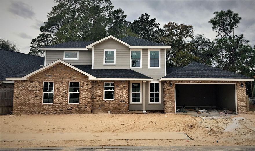 BRAND NEW 4bed, 2.5bath in the heart of Niceville! A beautiful 2 story with laminate wood flooring in all main areas on first floor, including the Master Suite. The kitchen offers 3cm granite countertops, dark espresso cabinets, large breakfast bar and stainless steel appliances. The Master suite, secluded from the other bedrooms, includes a nice sized tub/shower combo, double vanity with cultured marble tops, and a huge walk-in closet. Add'l features: Crown molding in the main living areas, 8' doors throughout on first floor, recessed lighting in main areas, plenty of storage, full landscaping with irrigation, privacy fence and a 1-yr builder warranty. Zoned for A+ Niceville schools and just a short drive to Eglin AFB or the beaches of Destin!