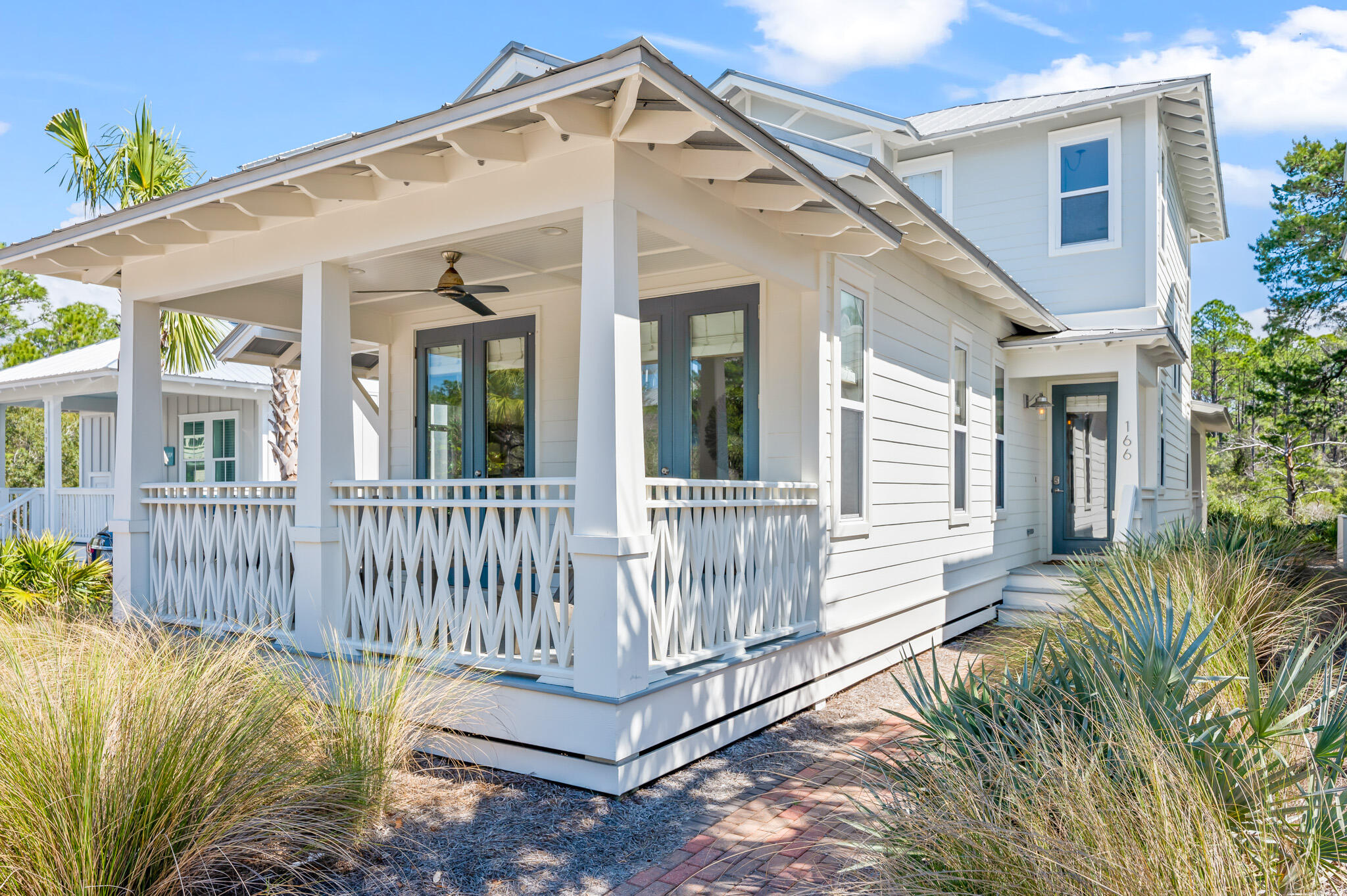 An exquisite rare offering giving you the ability to own one Seacrest Beach's most private homes with a backyard full of nature preserve that lends itself to picturesque views of the forest from its multiple porch spaces and no backyard neighbors. This exceptional location is just a 2-3min walk to the 12,000 sq/ft lagoon pool, directly next to one of the tram stops that shuttles you to and from the beach. Just 5mins to Rosemary, 5mins to Alys Beach, and ideally borders one of Seacrest's nature trails, so your morning walks can begin and end just a few steps off the back porch. This home greets you with wonderful southern coastal charm and curb appeal with its beach cottage style, well manicured landscaping, and beautiful craftsmanship displayed in the detail of the porch railings and the exposed rafters. This home is accented with hardwood plank floors, vertical shiplap accent walls, coastal decor, and abundant natural light throughout. There is a fully-stocked kitchen with utensils, cookware, blenders, coffee makers, etc. making this home a turn-key rental-ready opportunity. There is a powder room off the living room and an outdoor shower just out the home's separate entrance off the kitchen. The master is also located on the main floor with private access to the front porch. Upstairs there are 2 additional bedrooms, one 2nd master with ensuite bath and private porch access. The 3rd additional guest suite is currently set-up as the quintessential bunk room with ensuite bath. This home has been well maintained and is in pristine conditioned, and being offered fully-furnished and ready for its new owner. It would make the perfect 2nd home/beach getaway or vacation rental investment.