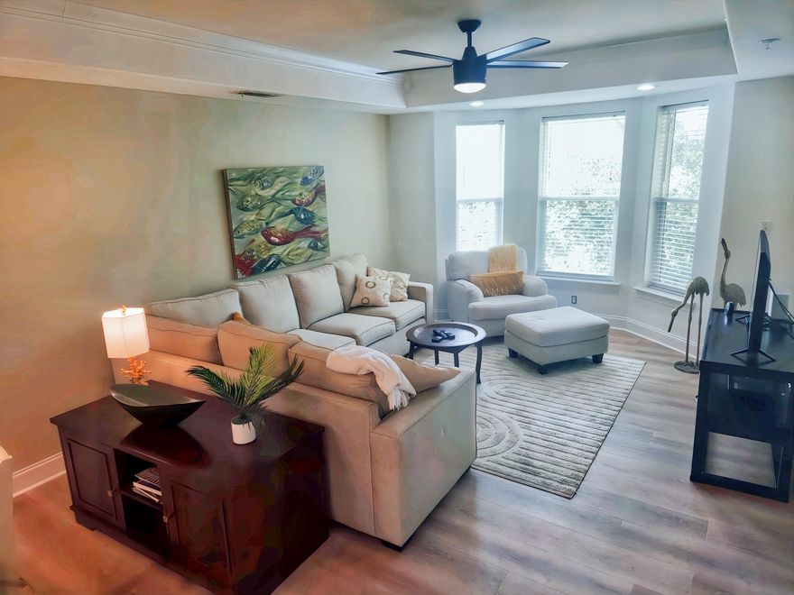 This well-appointed 1100 sq. ft. condo in Destin, Florida, offers a harmonious blend of comfort and style. The open-concept living area is bathed in natural light, featuring a tray ceiling and large windows that create an airy atmosphere. The living room is tastefully furnished with neutral-toned seating and accented by vibrant artwork.The modern kitchen boasts white cabinetry, stainless steel appliances, and granite countertops, with a convenient breakfast bar for casual dining. Both bedrooms are generously sized, and featuring ample closet space. Bathrooms are elegantly designed with contemporary fixtures and finishes.Throughout the condo, you'll find high-quality flooring, including tile in wet areas. The unit also includes a dedicated laundry room.