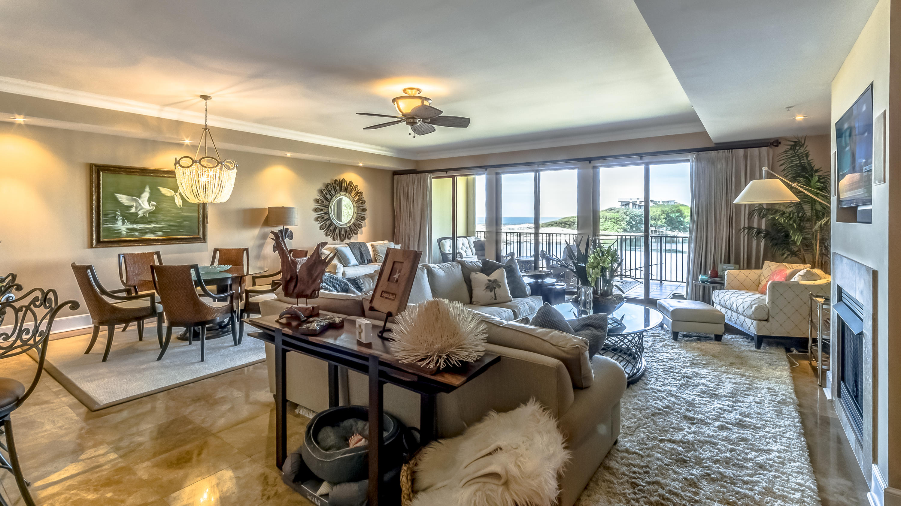 Walking through the door, you immediately know you've found that special place that you have been searching for... and when you walk into the great room and find yourself overlooking the Emerald Green waters of the Gulf you know you are home! You can see it all from the living room, kitchen, dining room, and master bedroom and bath. The moment you walk through the doors you will be in awe of the thoughtfulness and beauty that this 4,000 s.f. luxury residence offers. From the Travertine in the foyer, kitchens, living areas, dining, laundry and baths along with 10' ceilings, rich crown molding, 8' doors, fireplace, wet bar, to the tiled balconies with remote privacy screens, nothing was left to chance. Featuring a Chef's Exhibition gourmet kitchen with Viking Professional Commercial Series