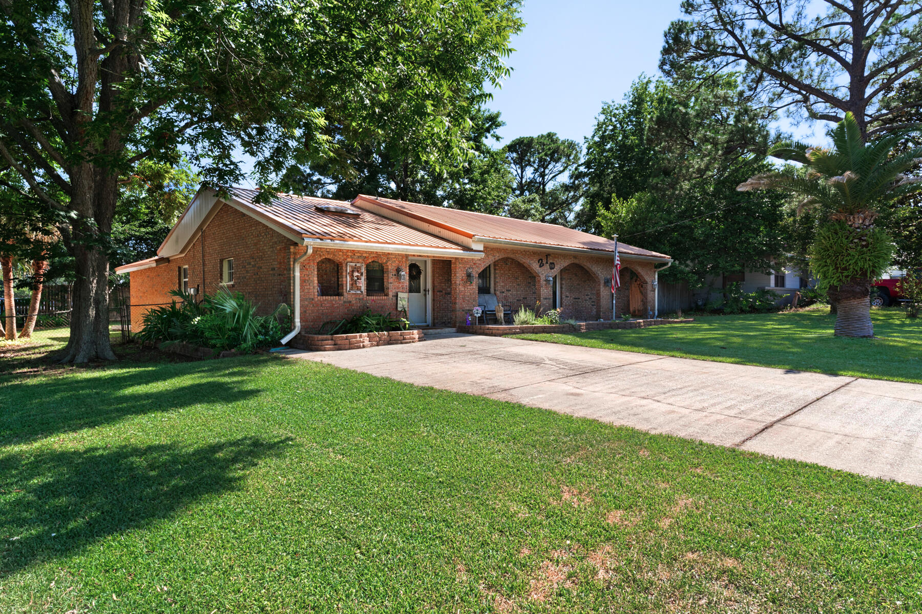This homey and inviting 4 bedroom 2 bathroom home sits right off miracle strip parkway and close to downtown Fort Walton Beach. The neighborhood offers a central location to the great dining options within Fort Walton area. The home is also across the street from Lisa Jackson park just a short stroll away. The property sits on a quarter of an acre with a fenced in backyard. The backyard also includes an enclosed shed. The home is less than a mile from the local elementary school, middle school, and high school making a great primary residence for a family children.