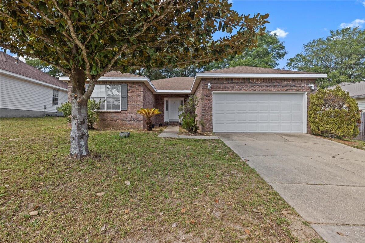 This 4 bedroom, 2 bathroom home is located in the heart of Niceville, and ready for your personal touch! FRESH PAINT throughout! Great open floor plan. Living room featuring a cozy fireplace, built-in shelving, and soft natural light.Kitchen with breakfast bar, gas stove, and pantry.Primary bedroom with walk-in closet, and an en-suite bathroom boasting both a luxurious garden tub and separate shower. Outside there is a fenced backyard perfect for hosting summer cookouts.