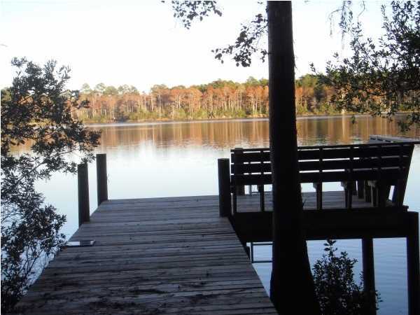 2 Beautiful lakefront lots (180 WF feet) on private lake with dock already on property. If you are looking for a place to build your dream home and enjoy quiet country living at it's very best, this is the place for you! These two lakefront lots (lots 18 & 19 Blue Cypress S/D) have been partially cleared and a quality dock built on property in 2011. This is a private, apx. 50 acre spring fed lake with no mobile homes allowed (covenants & restrictions apply; Only $50/lot per year). You will see no stumps in this lake!! With 186' of lakefront you will have plenty of room to enjoy your new or future home site and enjoy some great fishing and even swimming in the meantime (no gas engine boats). Come see these beautiful lots today!!
