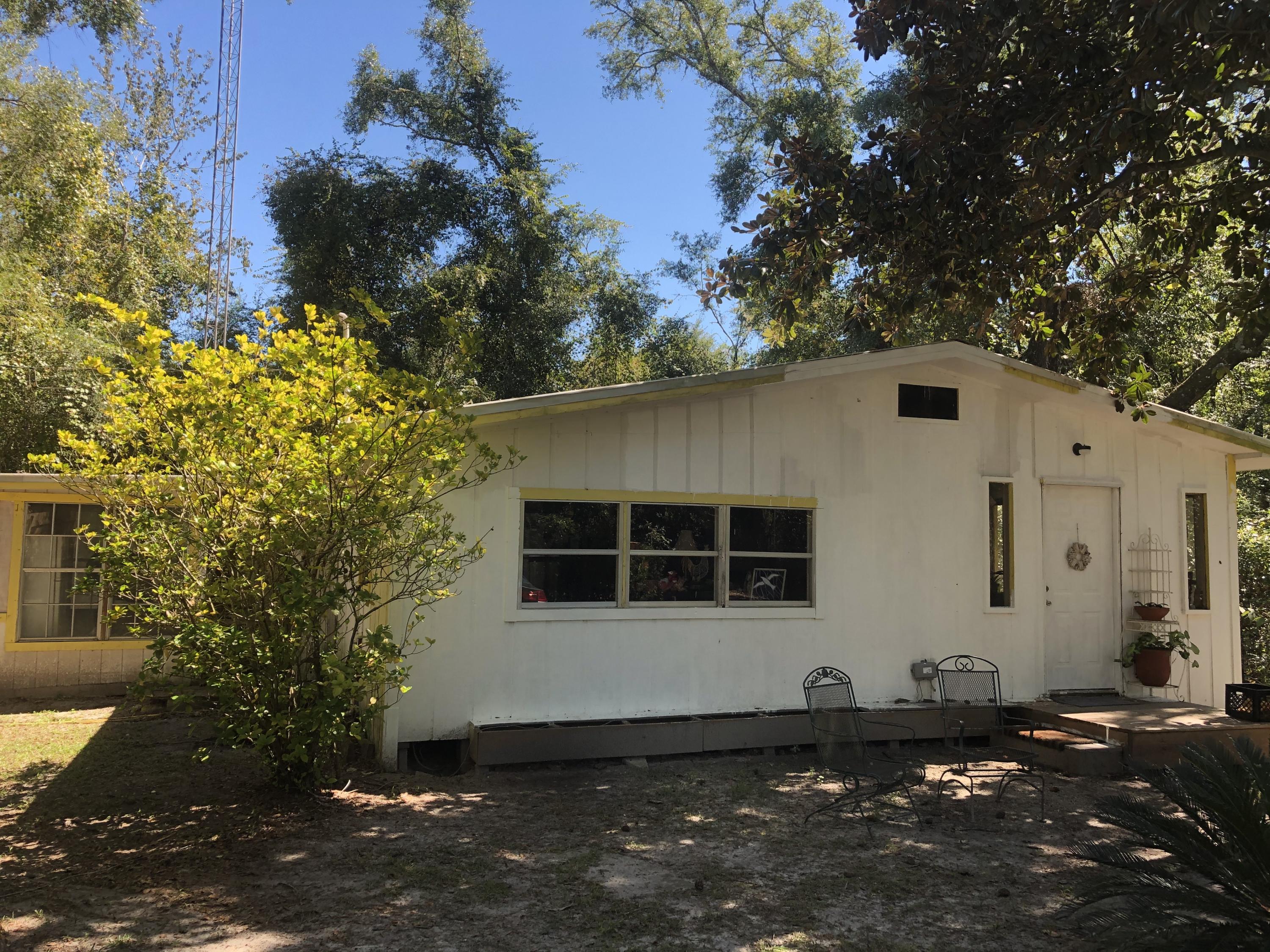 Retreat to this Rustic 2 bed/1 bath, 1039 sq ft cabin with lots of privacy. More Photos to come! This lovely property makes for a great get-a-way due to it's close proximity to Morrison Springs, (2) boat ramps providing easy access to Choctawhatchee Bay via Black Creek, 20 mins to Grayton State Park in Santa Rosa Beach as well as Panama City Beach. It is being sold ''As Is'' due to the age of the home and it does need some work. Cash only! It is currently being lived in and maintained. This would be a wonderful property to come into and make it your own providing you with an inexpensive place to come to for vacation or it can be a cute little place for someone who doesn't need much space. Property is unrestricted and short distance off paved road. Information contained within this listing