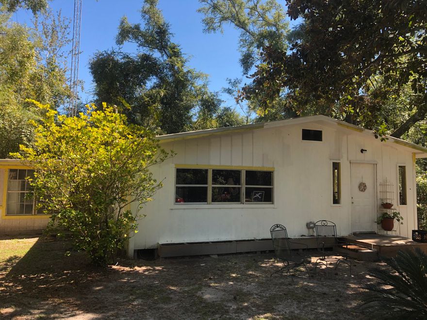 Retreat to this Rustic 2 bed/1 bath, 1039 sq ft cabin with lots of privacy. More Photos to come! This lovely property makes for a great get-a-way due to it's close proximity to Morrison Springs, (2) boat ramps providing easy access to Choctawhatchee Bay via Black Creek, 20 mins to Grayton State Park in Santa Rosa Beach as well as Panama City Beach. It is being sold ''As Is'' due to the age of the home and it does need some work. Cash only!  It is currently being lived in and maintained. This would be a wonderful property to come into and make it your own providing you with an inexpensive place to come to for vacation or it can be a cute little place for someone who doesn't need much space. Property is unrestricted and short distance off paved road. Information contained within this listing