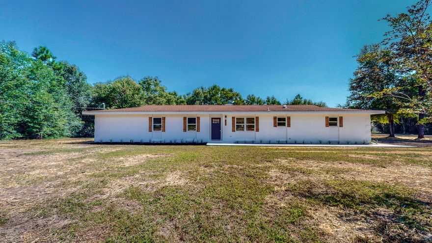 Newly renovated 3 bed 2 bath home on a large 1 ACRE CORNER LOT in Grandview area of Crestview! Open floor plan with a custom renovated kitchen, totally updated with beautiful new shaker style cabinets, white/gray granite counter tops, white tile back splash, stainless appliances and large island.  Custom ship lap walls/trim in several areas including fireplace.  New vinyl plank ''wood look'' flooring in living areas/baths, newly carpeted bedrooms and baths have been remodeled/updated with new vanities, hardware, white marble counter tops and refinished/new tub/showers. New vinyl clad windows and doors as well.  plenty of room to add a pool, workshop or RV Parking!