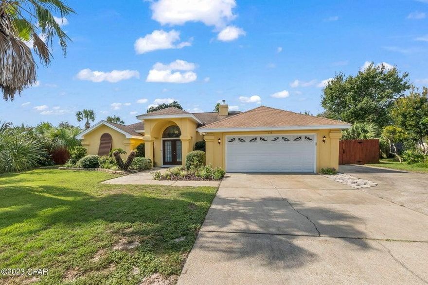 Under contract with a 72 hour kick out clause in place. Welcome to your new Panama City Beach Home, complete with all amenities to live the beach lifestyle to the fullest! Short-term rentals are allowed! This home is a short golf cart or bike ride to the beach! This Gorgeous three-bedroom two-bathroom home features an open floor plan with an expansive open feel, plenty of natural light, and 1787 square feet of living space. This home offers a wood burning fireplace, two car garage, and a nice sized heated & cooled Lanai perfect for entertaining. Outside you have a large fenced in backyard that offers a beautiful pool, fire pit, fruit trees, shed, No HOA, and a pergola. This home has so much to offer as a short-term rental or as a family home. Call for more information.