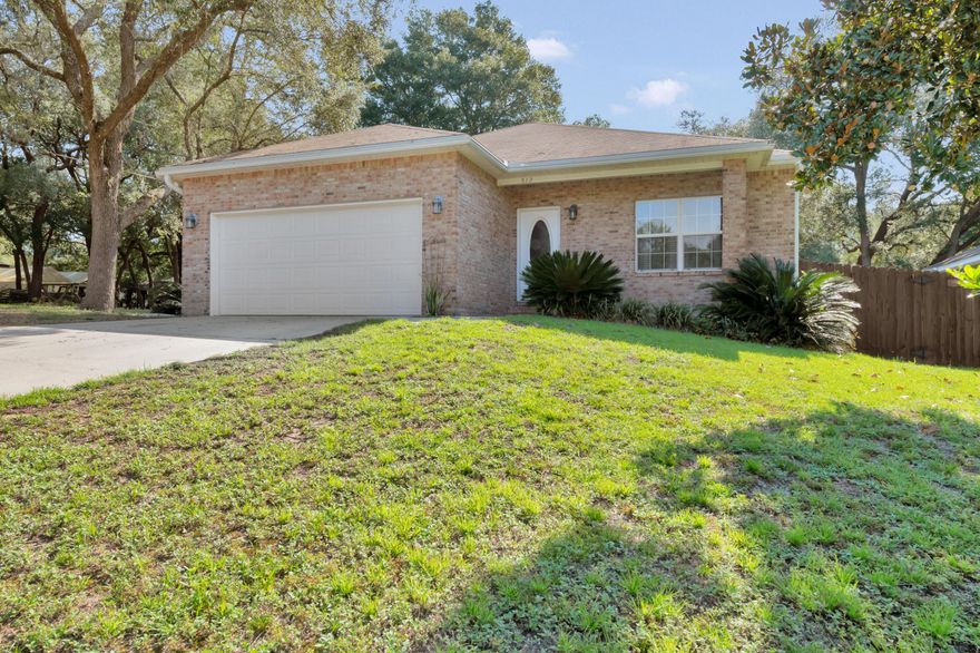 This move-in ready home is situated on a corner lot of a quiet street. The inviting foyer opens into an oversized living room with vaulted ceilings. The dining room leads to the kitchen with granite counter tops, stainless steel appliances, breakfast bar, and plenty of richly colored cabinets.  The split floorplan separates the large master bedroom from the guest bedrooms to ensure privacy. Grill and entertain in your backyard all year long  which features an 8 foot privacy fence, screened patio, and wooden deck. Only minutes from parks, wooded trails, beaches, Eglin AFB, Hurlburt Field, and Duke Field.