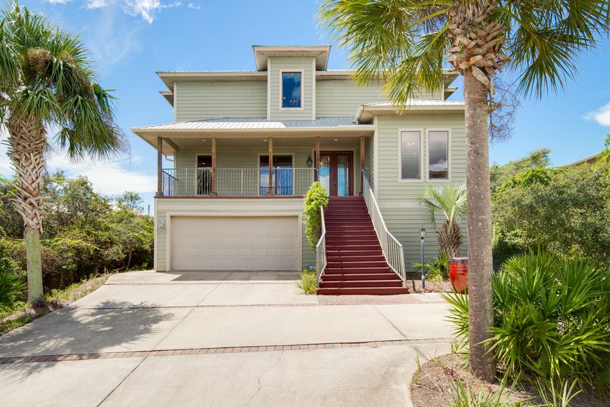 You will be amazed at this custom built home the minute you walk into the 2 story great room. It's numerous windows fill the entire room with an abundance of light that will welcome you not only to the beach, but truly let you know you are home. Custom all wood cabinets, upgraded appliances and two large covered porches to not only view the Gulf of Mexico, but also take in its gentle breezes and the essence of the coast. With tremendous space throughout, plus an entire 1200 square foot first floor waiting to be finished, this home would make a wonderful full time, part time or vacation rental. Please call today to see this truly one of a kind home.