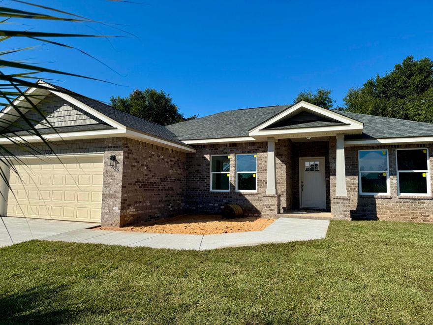 WOW FACTOR ALERT!! BRAND NEW BEAUTIFUL ALL BRICK COTTAGE STYLE HOME.  NO HOA! NO CARPET! LOW INSURANCE!SELLER OFFERING $10K TOWARDS BUYER CLOSING COSTS, PREPAIDS AND/OR RATE BUYDOWNS.KEY FEATURES: KITCHEN: Upgraded Quartz counters, White shaker style wall cabinets & large complimenting black island bar cabinet w/deco accent trims, tiled back splash, glass pendant lights, soft close drawers, Whirlpool SS appliances & Spacious walk-in pantry. LIVING ROOM: Airy & open to kitchen w/ recessed ceiling, crown molding, LED puck lights, Ceiling fan & french doors w/built in blinds to covered back patio.MASTER BR: Trey ceilings, crown, puck LED lights, ceiling fan. MASTER BATH: Upgraded Quartz counters, dual sinks, Lg beautiful custom tiled shower w/seamless glass door &  double shelved walk-in closet.
ADDITIONAL FEATURES: 
PREMIUM LVP floors throughout including Office & Bedrooms. 
24x12 Tile in Bath areas.
Tall covered rear patio, Ceiling fans w/light throughout, Upgraded Hurricane Impact windows, Fabric shield protection on doors, Upgraded Extra Wind Velocity Hurricane Garage Door, Pull down attic ladder, 4 Sabal Palms in front yard, Architectural Shingles, 5-1/4'' Baseboards, Crown in 10 ft. areas, Spacious rear & side yards with privacy fences & gate, Tall wall cabinets and storage closet in Laundry, RUUD HVAC unit, Hall linen closet, Roomy guest bath has Quartz counter, shower/tub combo & linen closet, Double car garage w/Genie auto opener, Extra wide 18' Driveway, 5' Wide entry walkway, Flat textured ceilings, Low-E Windows, Sprinkler System w/Well pump.
Local Established Builder & One year Builder Warranty.
Almost ready within 30 days!
This is a Gorgeous Home and only short drive to beaches, AF Bases & shopping/dining.
Call today for your tour!