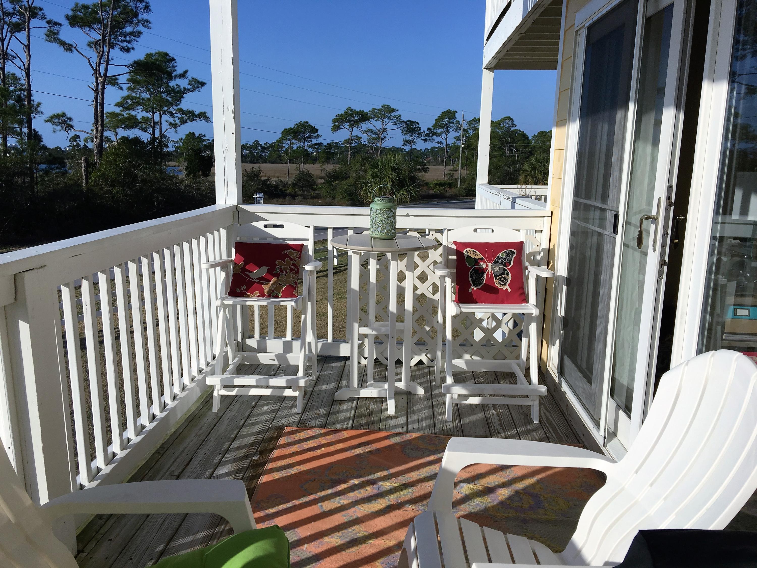 Gated Subdivision Located between the Perdido Bay and the Intracoastal Waterway just before you enter Innerarity Island. Immediately you will feel the tranquility of this location. Amazing Sunrise, Sunsets and water views to die for and Fascinating Wildlife. Pool, club house and fitness center. A lot is offered here. This property speaks for itself. Upgrades galore!. Granite counter tops, high end newer carpeting, A/C and dishwasher and washer and dryer are less than 2 years old. Appliances will convey. Furniture (except for deck furniture) is negotiable. There are some items that will not stay. This love property is close to Perdido Key & all of the general area shopping, restaurants and attractions. Just a short distance to Johnson Beach and NAS Pensacolabut you may not want to leave..
