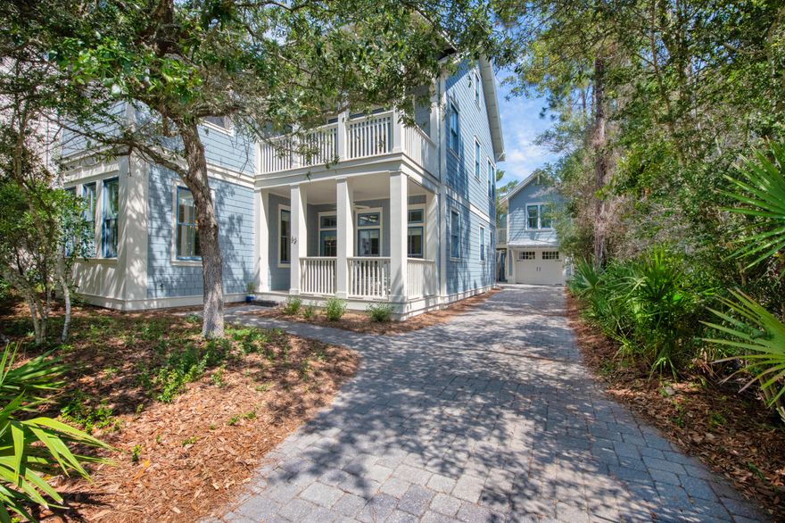 Nestled in a cul-de-sac, this beautiful beach house was designed by Ben Showalter Architects as the sellers second home in WaterSound Beach gated Bridges community.  Enjoy the Bridges community pool within a 5 minute walk and an additional 5 minute walk to the pristine Gulf of Mexico. It boasts of custom cabinetry throughout with granite countertops and Brazilian teak hardwood flooring and is sold furnished.  First floor invites you into an open living room, kitchen & separate dining area for family & friends.  There is a guest bdrm with ensuite as well as an additional full bath for guests. Going to the second floor, you have an additional guest bdrm and guest bath, a kid's bunk room that sleeps 4, office, laundry room & master suite. The master bedroom opens to a screened-in porch with an additional open deck to the office.  The master bath's ensuite has a tiled walk-in shower, tub and double vanity. The rear second floor covered deck has a walk-way to the finished studio above the garage or stairs from the ground level. Third floor has a bonus room with sleeper sofa and bar sink with small refrigerator and a nice sized 1/2 bath. The spiral stairscase leads to a tower room with plenty of windows for viewing and a deck to sit and enjoy the views of the gulf and WaterSound community. Relax in the private backyard that has a brick paved patio as well as an enclosed outdoor shower for rinsing off when coming from the beach or pool. If a private pool is desired, the owners have preliminary approval from the HOA as well as a design sketch. Never run out of hot water for you or your guests with a gas rinnai. The 3rd floor HVAC was replaced in 2019, 1st floor in 2022 and 2nd floor in 2023.  HVAC in the studio above the garage was replaced in 2024. WaterSound community offers restaurants, recreation, dog park, puttering park and fitness center. Enjoy 18 miles of walking / biking from Rosemary Beach to Dune Allen along Hwy 30A.