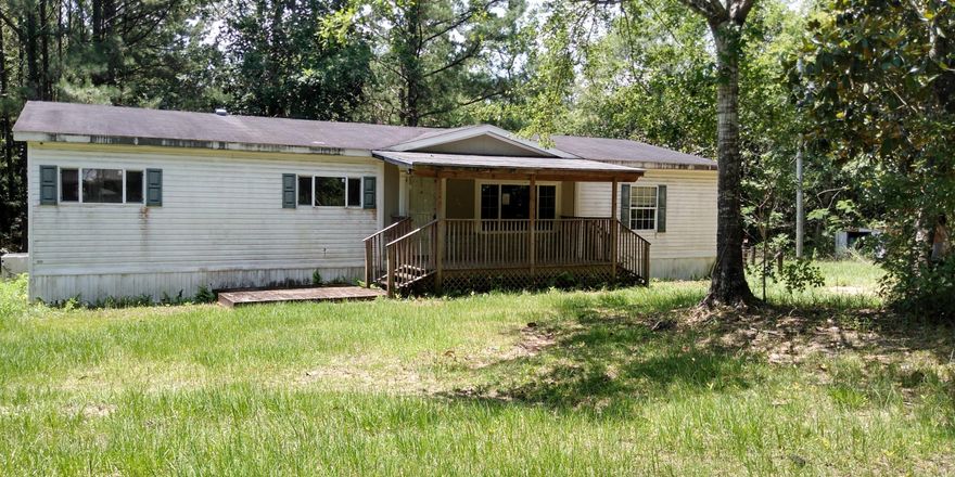 Escape the hustle and bustle to the privacy of this 3BR/2BA REO mobile home situated on 10 acres of secluded land! The home features a covered front porch, spacious living room, eat-in kitchen with center island & pantry, sizable guest bedrooms with plenty of closet space and master bedroom with a private bath offering dual sinks, a garden tub and separate shower. Located just minutes from I-10 with easy access to shopping and dining. All Information recorded in the MLS is intended to be accurate but cannot be guaranteed, buyer advised to verify. Sold As-Is. No utilities will be turned on to this property and only cash/renovation loan offers with 0 day inspection period will be considered. Buyer should perform their due diligence/necessary inspections before submitting an offer