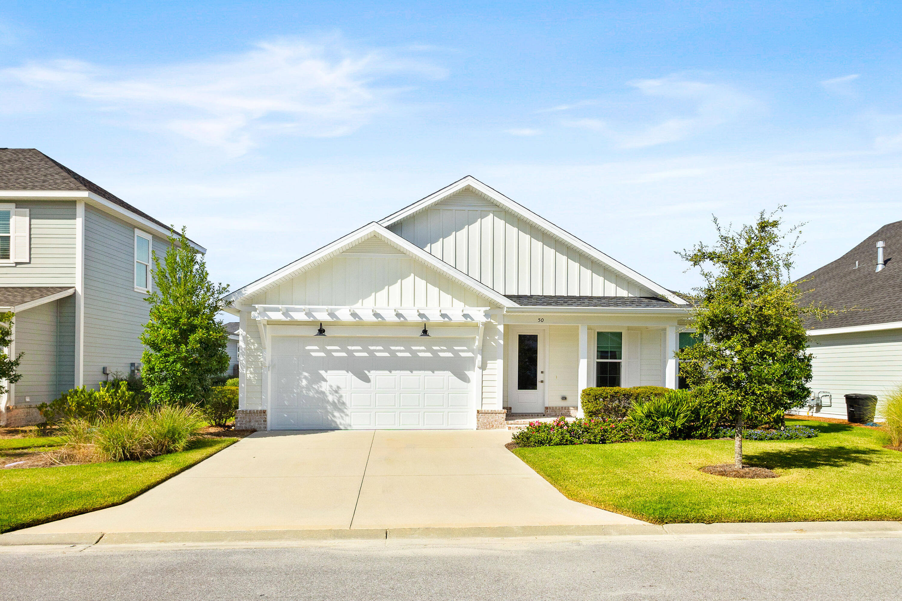 Welcome to the 50 Conifer Ct, a thoughtfully designed revised Bella floor plan in the Stillwaters phase of Watersound Origins! This beautiful coastal home has been meticulously maintained and boasts 3 bedrooms, 2 bathrooms, screened in porch, and 2 car garage. The open-concept living, kitchen, and dining spaces are bathed in natural light flowing in. The kitchen is light and bright featuring stainless steel appliances, quartz countertops, and a coffee/dry bar perfect for hosting! The adjacent dining area and inviting living room flow seamlessly, ideal for entertaining family and friends or relaxing next to the cozy gas fireplace. Retreat to the primary suite, complete with a walk-in closet and ensuite bathroom featuring dual vanities and tiled shower. Two additional well-appointed bedrooms provide versatility for guests or a home office. Outside, enjoy the coastal breeze on your covered porch, overlooking a beautifully landscaped yardperfect for morning coffee or evening gatherings. Residents of Watersound Origins have access to resort-style amenities, including a community pool, fitness center, and miles of scenic walking trails. Don't miss this opportunity to own a piece of paradise in one of the most desirable