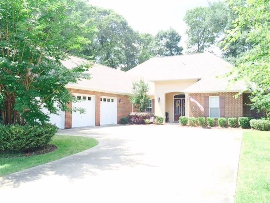 Beautiful custom home in the heart of Claire's Vineyard with many upgrades added. House has 4 bedrooms in 3 separate areas. There is an additional study (not included as bedroom.) Beautiful great room with lots of natural light and fireplace. Many custom built-in cabinetry in the study, great room, kitchen and master closet. Additional fireplace is the master bedroom. A three car garage. Lots of storage above the garage. Ceiling heights are between 10' and 12' throughout the house. Master, dining room and great room have treyed ceilings and crown molding. Beautiful hardwood flooring throughout living area/dining area. Bedrooms all have upgraded carpet. Travertine floors in kitchen and bathrooms. Outside screened in lanai wraps around the back of the house to take full advance of beautiful