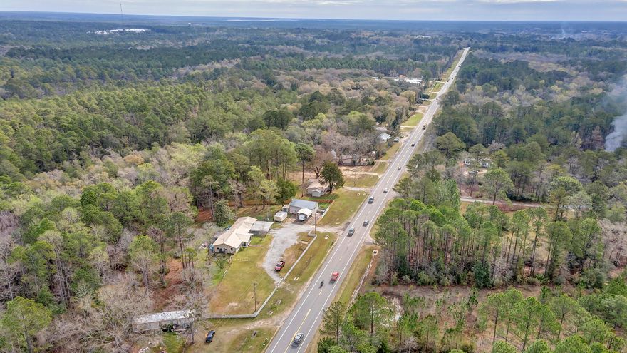 Welcome to Freeport! This 2.38+/- acres is located one mile from town center and 1/4 mile from Hammock Bay! Property is zoned Residential Commercial. The 5/4 home is grandfathered in and can be used immediately without any changes to building footprint (as an office). There is a 40x30 shop/warehouse building that is plumbed for a bathroom. Numerous storage sheds and a large electric changeable sign that is also grandfathered in.  Allowable uses include, but are not limited to; office, restaurants, retail stores, motels, shopping centers, parking lots and much, much more! Live in one side, work out of the other! You can do both here! Buy today, open up your business tomorrow! No waiting! Be sure to check out the virtual tour and drone photos. Call to schedule your appointment to view today!