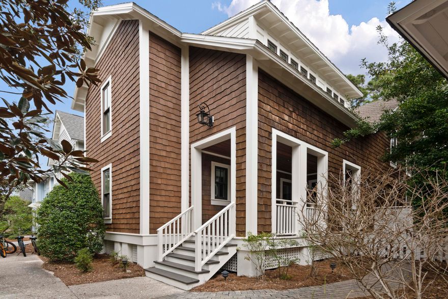 Discover your beach lifestyle at this one of a kind cottage style home in Watersound West Beach.  Located directly on sought after Horseshoe Park, this property features two spacious park facing porches as well as a pavered outdoor patio.  This lovely home boasts three large bedrooms that easily accommodate king size beds and all have ensuite baths.  There is also a bunk room for the kids!  The spacious master retreat features a private porch/balcony, two custom closets, double vanity in bath, and a cozy bonus nook perfect for an office or sitting room.  Enjoy time with family and friends in the open concept living/dining area with french doors out to the screened porch.  The kitchen has stainless appliances, wood cabinetry, breakfast bar and all new quartz counters.
