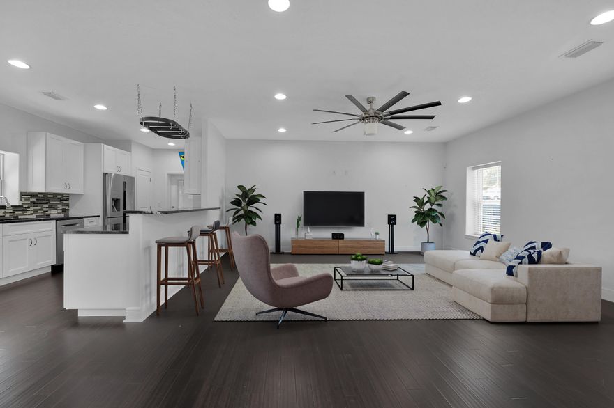 You MUST SEE this home! ENERGY EFFICIENT ICF (insulating concrete form) home. Better construction and value than a standard build. This contemporary home is so cool! From the metal siding and stone accents to the hurricane impact windows and doors, to the negative edge POOL with low maintenance salt system, you will appreciate all the features this home has to offer. Hardwood flooring and LED recessed lighting throughout this open floor plan. Step into the great room (w high ceilings) that has a view to the fantastic kitchen. You'll find granite counters, a tile back splash, pantry, breakfast bar, and newer upgraded stainless appliances. Check out the first floor master bedroom with a luxurious tile/glass shower and the coolest floating double vanity you've ever seen! Click