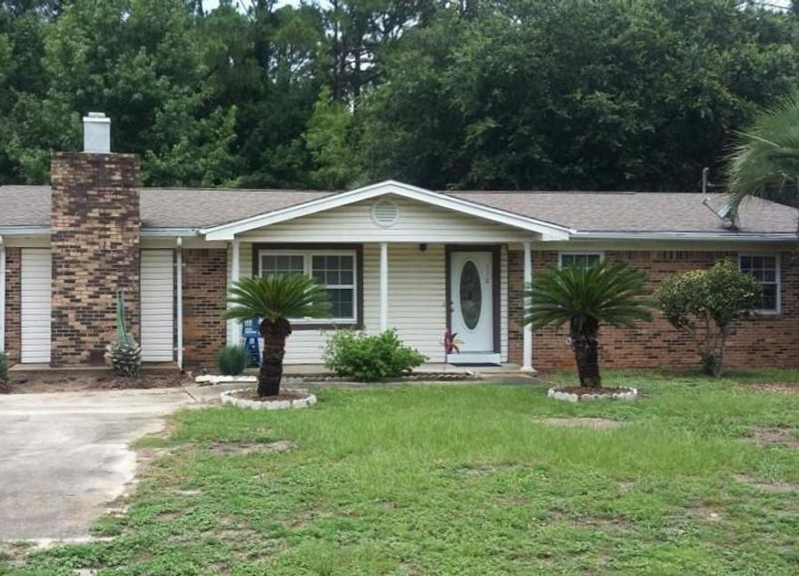 This home is conveniently located right off Hwy 98, minutes from Hurlburt Field, several great schools, and our beautiful Emerald Beaches.This two-lot property offers the main house and a 700sf plumbed and wired, detached garage with lots of storage space. Lot is a 1/3 of an acre and the property backs up to the forest so no backyard neighbors as you enjoy the peace and serenity all around.The inside of the house has been renovated to include hardwood floors, new carpet, open architecture (natural lighting throughout), brand new kitchen, bedrooms all carpeted and freshly painted, comfy Family room with a fireplace is a bonus as well as the 240sf Florida room. Beautiful mature trees all around the property.