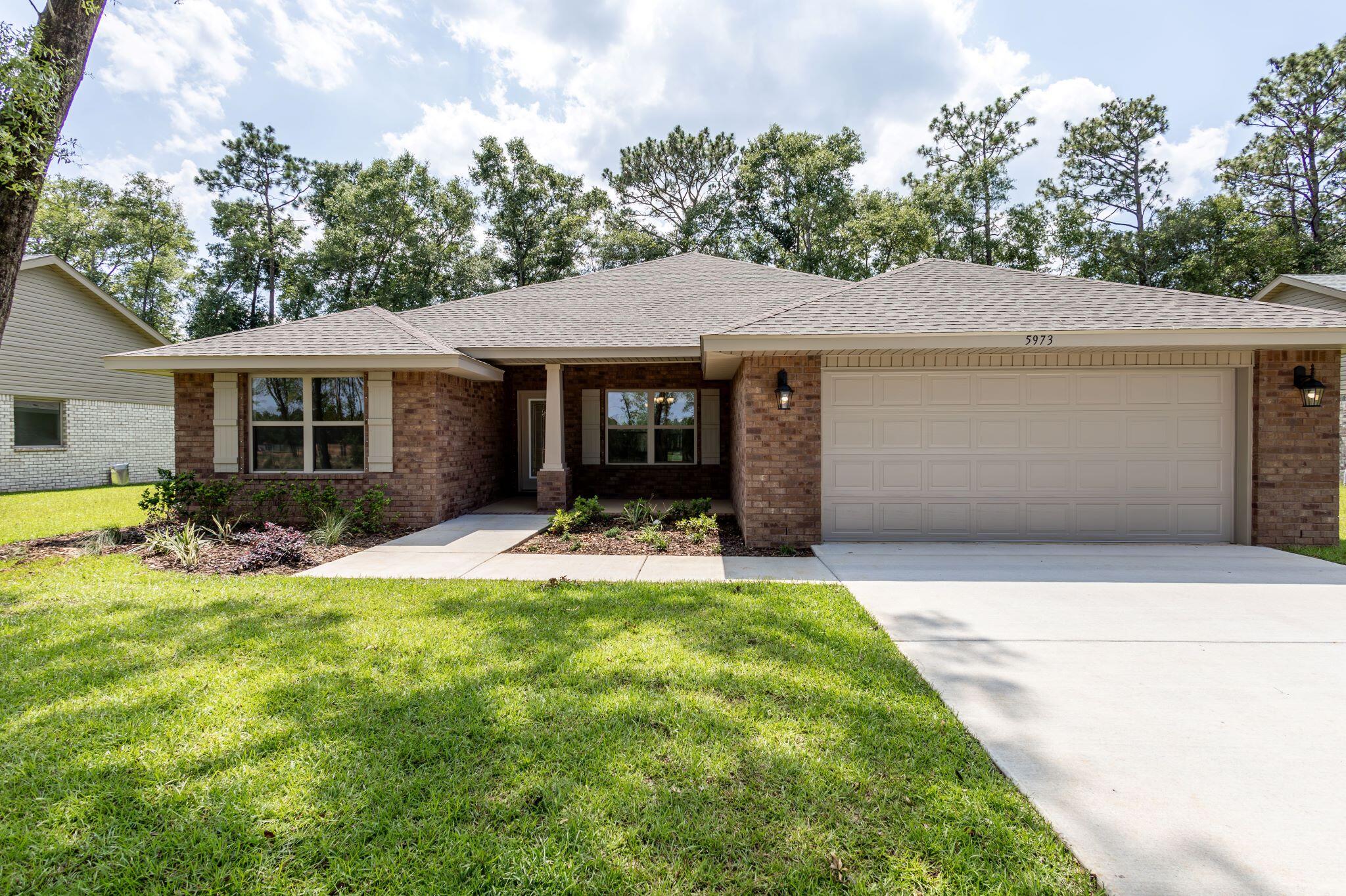 This perfect home comes with 4 bedrooms and 3 bathrooms. The kitchen has white lace quartz counter tops and cabinets are gray, cape cod style. There is a walk in pantry just off the kitchen. Floors are upgraded with LVP flooring everywhere but bedrooms which have carpet. The bathroom cabinets and countertops match the kitchen. The family room is open to the kitchen and breakfast nook. There is also a formal dining room. . This is a split bedroom plan. The master bedroom has a trey ceiling with ceiling fan and has its own en suite with a large walk in closet. Bedroom 2 has its own full bathroom and bedrooms 3 and 4 share a bathroom. This home is all electric and comes with stainless appliances(microwave, smooth top range and dishwasher.This home has an exceptionally large backyard!