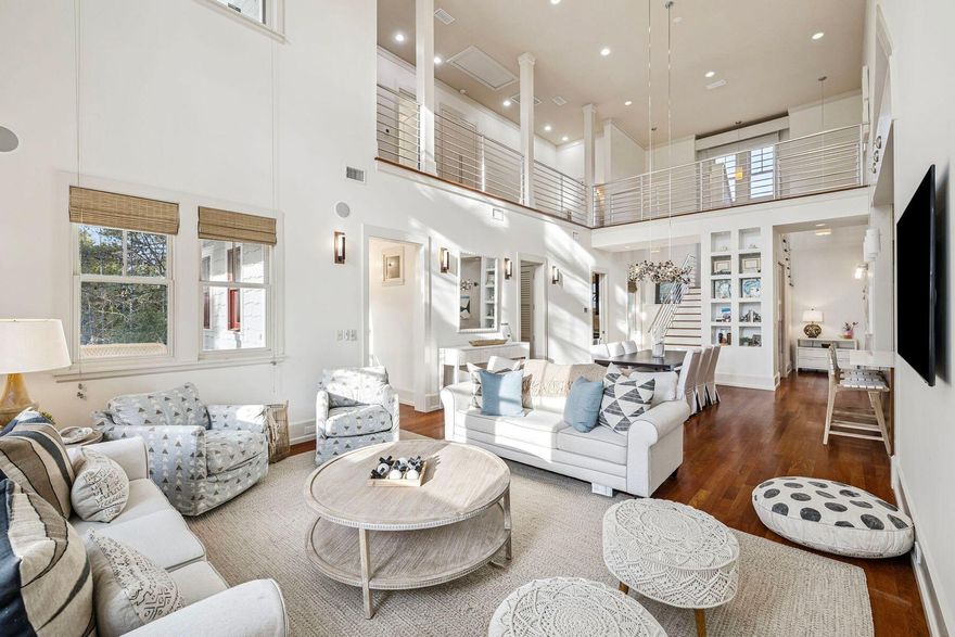 Experience elevated coastal living in the exclusive Peninsula section of WaterSound Beach. Nestled on a generous wooded homesite in a quiet, nature-filled setting, this Nantucket-style residence offers exceptional privacy just steps from the sugar-white sand and only a one-minute walk to Camp Creek Lake. Recently enhanced with a 2024 roof, 2023 and 2024 heating and cooling systems; the home provides both peace of mind and lasting value.A broad paved driveway only accessible to residents & welcoming front porch introduce a thoughtfully designed interior where soaring 22-foot ceilings, open galleries, and triple-high transom windows fill the home with natural light. Bolivian rosewood flooring and striking Italian marble accents add warmth and sophistication,  while hard wiring for a Control4 smart home system ensures modern convenience. 

The main floor open kitchen is designed for entertaining, featuring double ovens, Sub-Zero appliances, a wine refrigerator, ice maker, exotic wood cabinetry, and a large center island. Outdoor living shines with a private backyard offering a space to spread out and play securely. 

The home includes three furnished spacious bedrooms, each with its own ensuite bath. Two guest suites are located on the first floor, while the second level is dedicated to a stunning primary suite with a private balcony and spa-inspired bath.

Approved architectural plans for both a carriage house & a third floor fourth bedroom and full bath convey with the property, and the gracious oversized homesite offers ample room to add a carriage house, pool, and two-car garage  creating outstanding flexibility and long-term value.

Enjoy access to Camp Creek Lake, private beaches, community pools, scenic boardwalks, green spaces, and optional membership to the WaterSound Beach Club. This is a rare opportunity to own a home that seamlessly blends architectural presence, privacy, and expansion potential in one of WaterSound Beach's most coveted enclaves.
