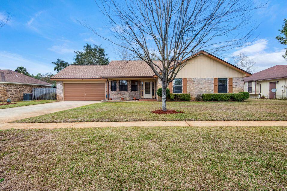Located only minutes from Hurlburt Field  Inside you'll find a formal dining room, a sunken living room with vaulted ceilings and a brick fireplace, an updated kitchen with eat-in breakfast area, 3 bedrooms, and 2 full baths. The laundry room is off the kitchen and includes storage for a pantry! The 2 car garage also features a huge storage area. Out back, you'll find a screened porch, covered grilling area, fully fenced yard and beautiful pergola. Call our office phone number for any and all information and to make an appointment to view
