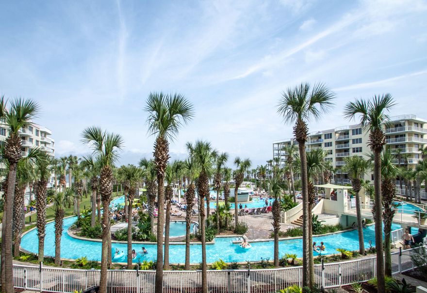 GORGEOUS VIEWS OF THE LAZY RIVER!!! This two bedroom plus private bunk room features crown molding, granite countertops and much more. It was never rented. The unit is being sold furnished, floors are tile throughout. The balcony is accessible from the living area & master bedroom. The master bedroom suite has a luxury bath while the second bedroom & bunk room share the second bath. There is a stackable washer & dryer for added convenience. Destin West Pelican sits next to a large courtyard encompassing the Lazy River, two private heated pools, a zero entry pool & a large heated pool with a fun waterfall.