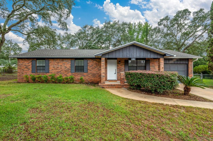 Welcome to this beautifully updated ranch-style home situated on a spacious lot in the heart of Valparaiso. With timeless curb appeal, including classic brick exterior and exterior plantation shutters, this 3-bedroom, 2-bath home offers both comfort and style. Step inside to find tasteful luxury vinyl plank flooring throughout the main living areas and a large, light-filled living room with a ceiling fan and recessed lighting. The renovated kitchen boasts upgraded cabinetry, stone countertops, stainless steel appliances, a built-in coffee bar, a quaint dine-in area, and a window above the sink that adds natural charm. A small pantry offers extra storage. All three bedrooms are newly carpeted and feature ceiling fans for added comfort. The spacious primary suite includes two closets and a private en-suite bath with a large glass-enclosed walk-in shower, single-sink vanity with stone countertop, and matching cabinetry. The guest bathroom features a bathtub-shower combo and complementary finishes. Enjoy outdoor living with a screened-in back patio overlooking the expansive backyardperfect for relaxing or entertaining. A large shed with a garage door provides extra storage or workshop space. The home also includes a single-car garage with opener, washer and dryer, and ample driveway parking.