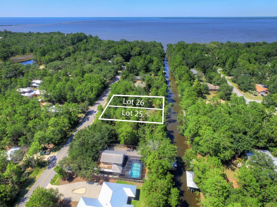 FOR SALE, LOT 25 ONLY. Beautiful waterfront lot in Point Washington near the beaches of South Walton. This lot boasts 100 feet of deep water canal leading directly to the Choctawhatchee Bay as well as large magnolias & mature oak trees. Incredible elevations, flood zone X. No flood insurance required. This lot has an 80' irrigation well. This huge lot is just minutes to the beach and all the best dining, unique boutique shopping, art galleries, art festivals, outdoor concerts, bike paths & some of the most challenging golf courses the gulf coast has to offer. Easy access to Hwy 98, allowing you to explore the nearby cities of Destin or Panama City Beach, as well as the Northwest Florida Beaches International Airport.