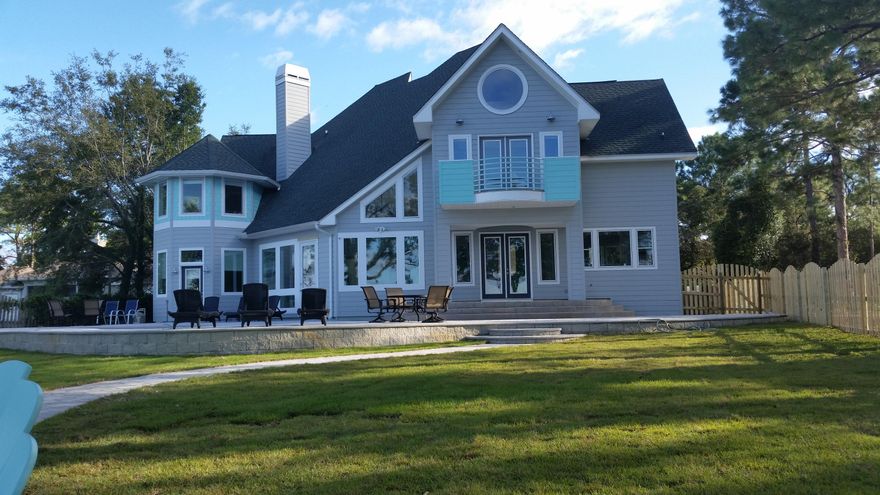 Exquisite and Architecturally Unique Contemporary BAYFRONT home. This tranquil home which sits on 1+ acre has recently under gone a complete rebuild renovation. Glamorous master suite and bath featuring coffee bar, a separate yoga loft and a huge walk in shower. EXTRA LARGE custom closet with full size washer and dryer. 4 or 5 additional bedrooms depending on how new owners decide to use bedroom space. The custom kitchen features 48'' Thermador gas range with pot filler, 2 Bosch dishwashers, ice maker and beautiful marble counter tops. All Baths and Kitchen are outfitted with HANS GROHE European fixtures. Laundry / Mud room off kitchen with large custom storage closets. There is a private outdoor shower. Beautiful bay front pool and 2 level custom patio with a firepit