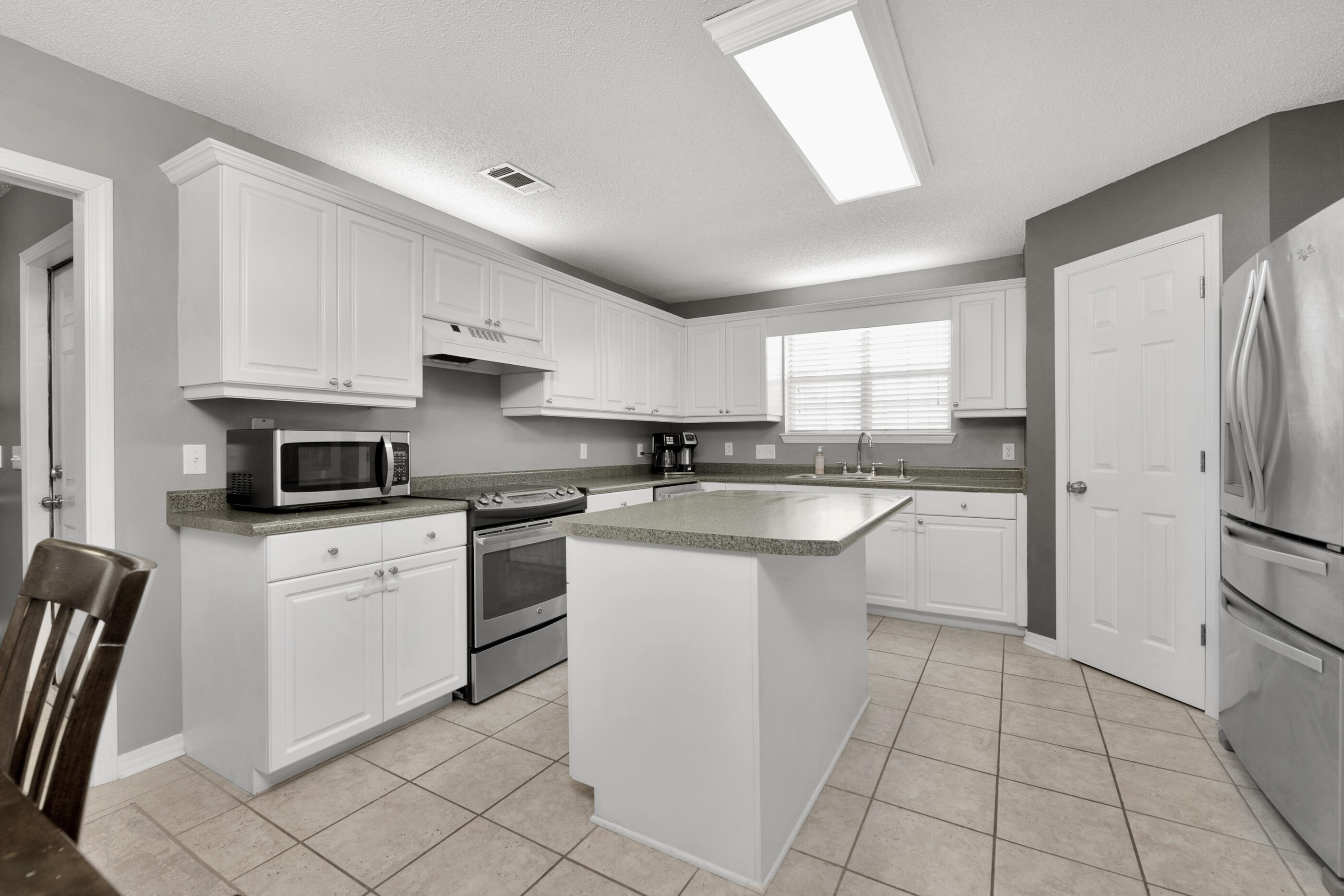 Multiple Offer!! Seller is asking for Highest & Best by 3:00, November 22 .A classical brick beauty with great bones, allows you to enjoy privacy without giving up the benefit of convenience! This endearing starter home is located on a quiet cul de sac in country breeze estates and a short drive to all Navarre has to offer. You will immediately notice the tree lined setting and impressive lot size with a fully fenced yard that is wonderful for yard activities and gatherings. The well-proportioned floorplan boasts practicality that features a split floorplan and open concept layout. The quaint entryway opens to a view of the entire main living area that features a neutral color palette and tiled flooring in all main living and wet areas. To the right, you will find the open kitchen and the