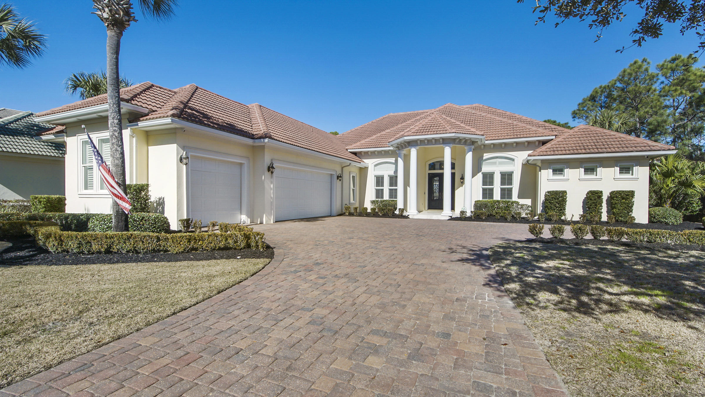 BEAUTIFULLY REMODELED HOME!  Quality craftsmanship all throughout this luxurious custom-built home. Wrought iron French doors as you enter this home with sky-high ceilings ranging from 11 to 15 feet with numerous tray ceiling designs, arched doorways, columns to accent various rooms, and recessed lighting. It has a serene enclosed pool that backs onto a nature preserve to ensure maximum privacy for future homeowners. Tons of upgrades all throughout the home including new solid core doors, BRAND NEW 2021 Renco generator installed, and dark wood-look tile floors that flow throughout the entire house. Upon entering the property, there is an oversized dining room with plantation shutters and an additional foyer directly off the entryway. The enclosed wet bar displays an arched opening,