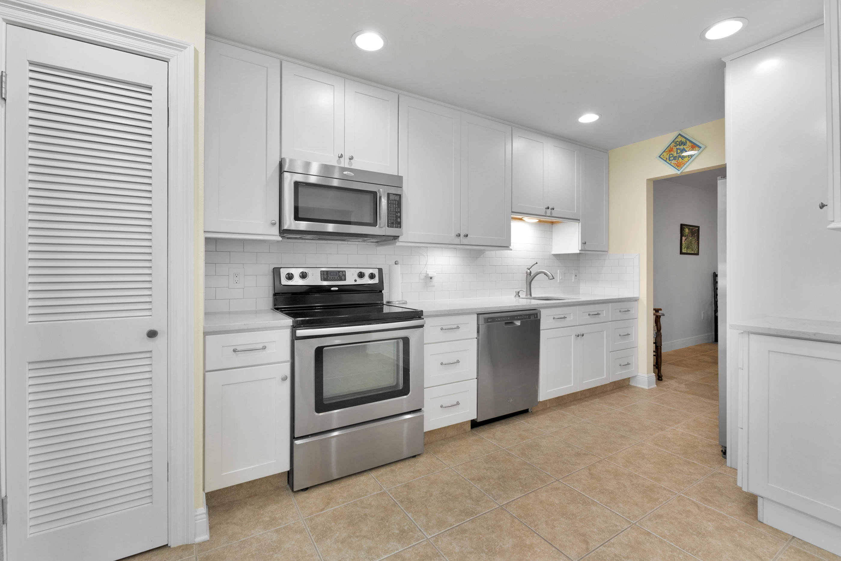 It may be April 1st but this is no joke! Completely renovated and ready for YOU!! Move in and enjoy low maintenance, easy living in this fantastic home where everything has been done for you! Check this out: full kitchen renovation, master bathroom remodel, guest bathroom remodel, tile floors throughout, painted with soothing coastal colors, recessed lighting, HVAC 2020, pavers installed....and more...this is a MUST SEE property! Start with the private, pavered courtyard (21x17). Then step inside the entryway of this wonderful floor plan. The great room features high ceilings, tile floors and a dining area. The eat in kitchen has quartz, a pantry and coffee bar. Enjoy indoor/outdoor living in a cheery 4 season screened porch w/acrylic inserts. The master bed/bath boasts READ ON