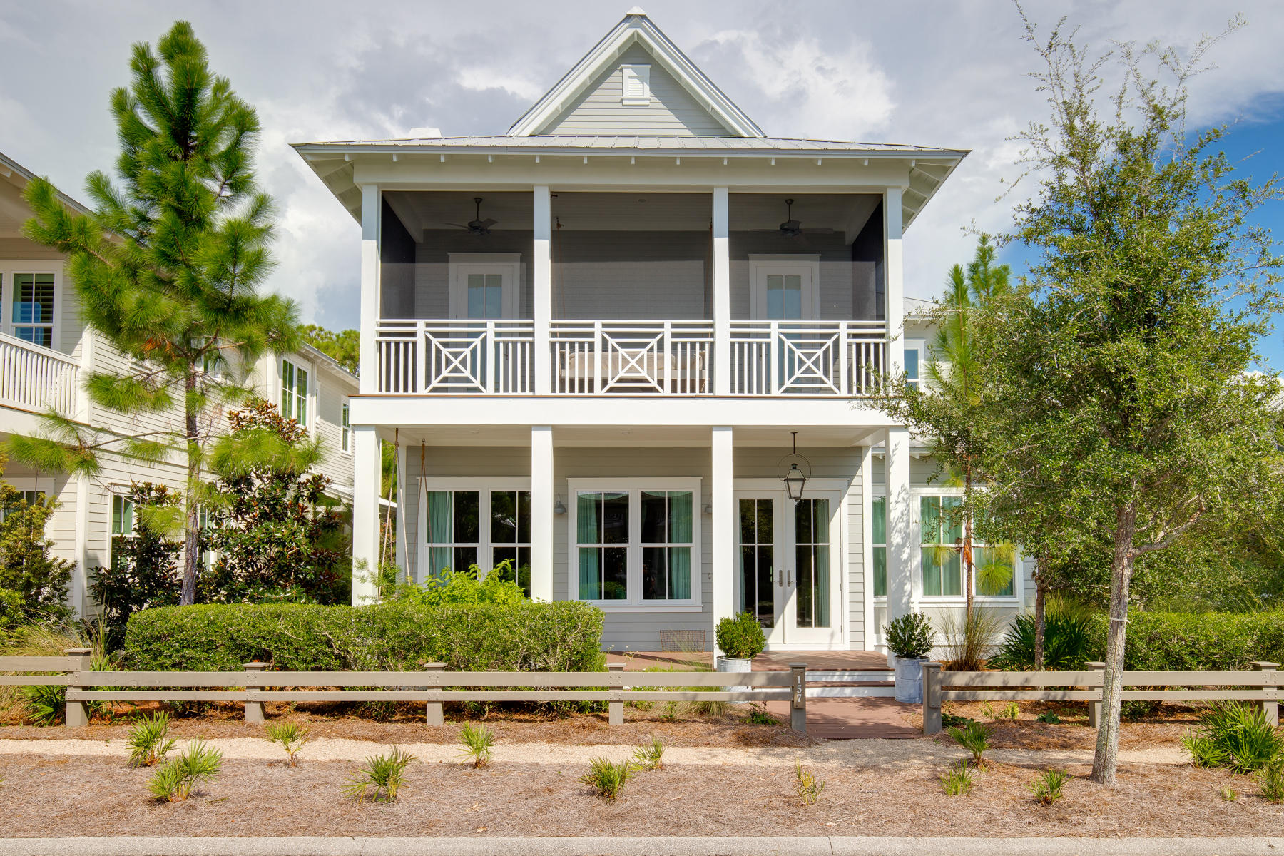 Discover a crisp coastal style in this custom-built Romair home in the popular WaterColor Crossings District. Nestled on a large corner lot along a quiet street, this 6BR/6.5BA home serves well as either an investment property or a full-time residence with a location convenient to community amenities, the beach and nearby dining and activities. An open-concept design comfortably accommodates a crowd in the 5 BR main home while a 1 BR carriage house is the perfect space to host guests. Special features include a 2-car garage, a fenced backyard, hardwood floors throughout, Coastal Living cabinetry, a Dacor appliance package, a gorgeous quartz kitchen island, dual washer and dryers and designer lighting.