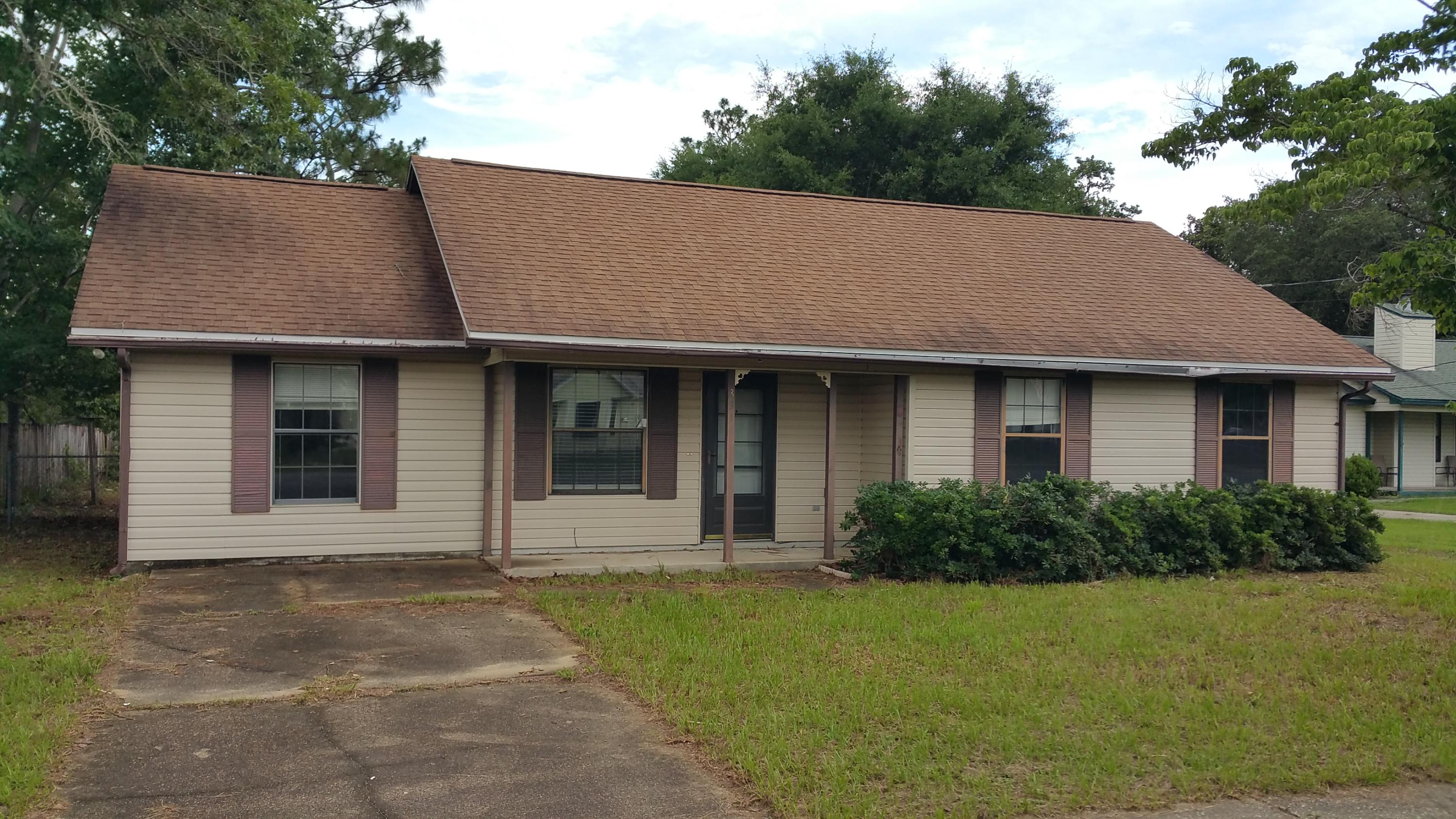 This country style charmer on almost 1/2 an acre in South Crestview is well worth a look! The garage has been converted to a nice family room and also has a large heated & cooled storage area. There's an inside utility room, ceiling fans thru-out, ceramic tile kitchen, chair rails and treyceilings. Enjoy the large fenced backyard while relaxing on the screened back porch. There's also a large boat/car port in the back as well as a storage shed. Don't miss out on this great opportunity!